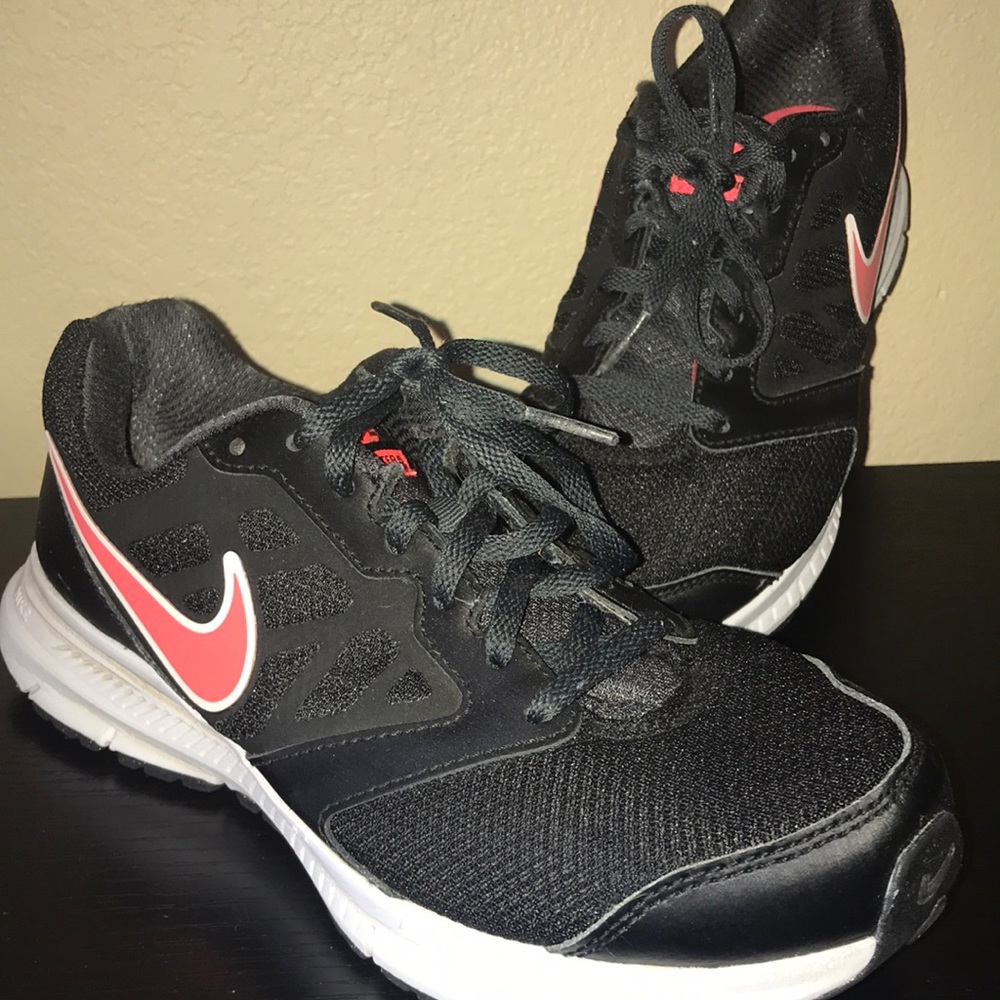 Nike running shoes with pink nike swoosh